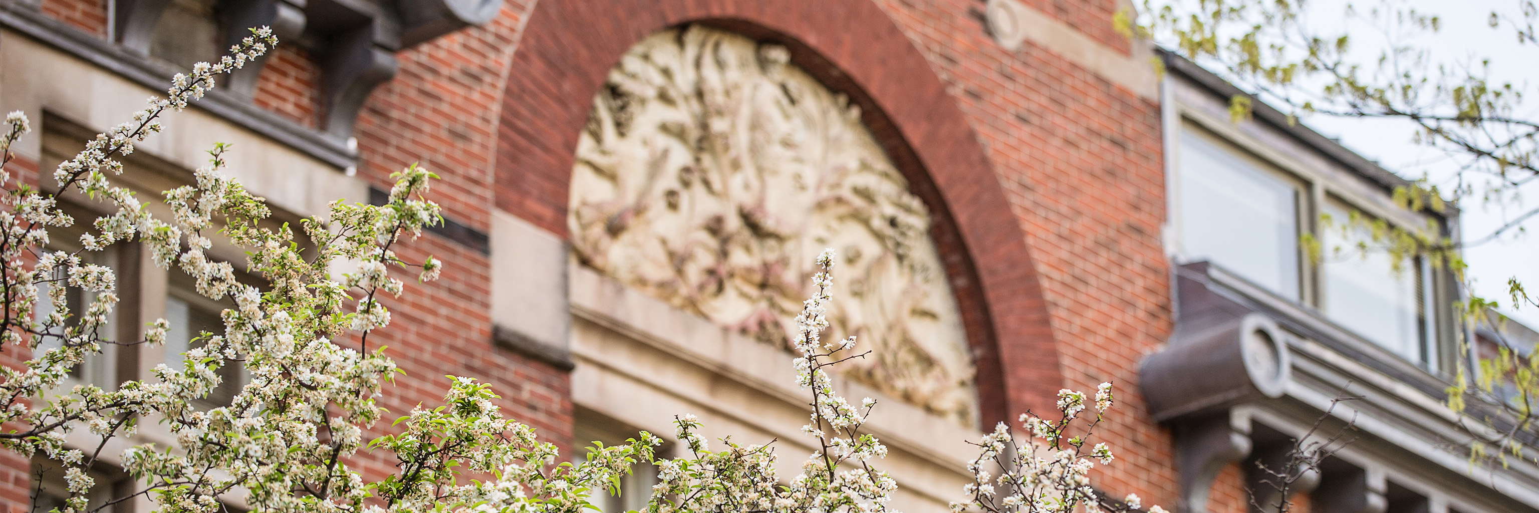 A limestone carving of flowers at the entrance of Owen Hall.